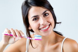 Brushing a beautiful smile shows the importance of oral hygiene