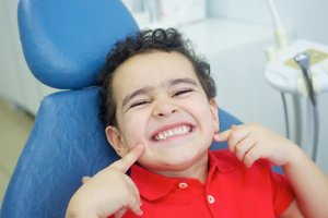 Cute kid smiling during National Childrens Dental Health Month