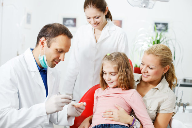 Young girl getting an exam at a family dental center