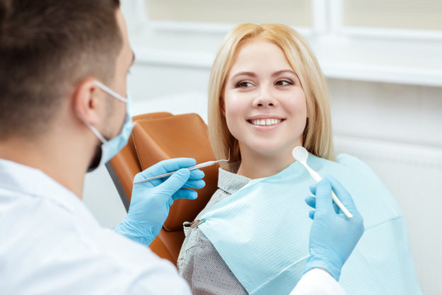 Happy patient learns how to deal with dental anxiety
