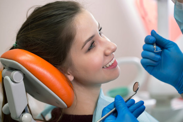 Smiling patient learns how she can relieve TMJ symptoms